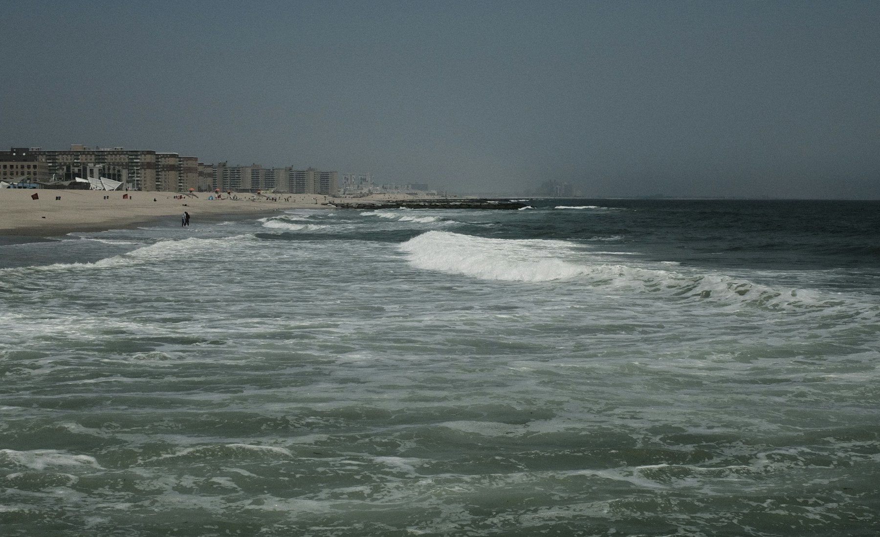 Atlantic waves and the shoreline at Rockaway Beach in Queens